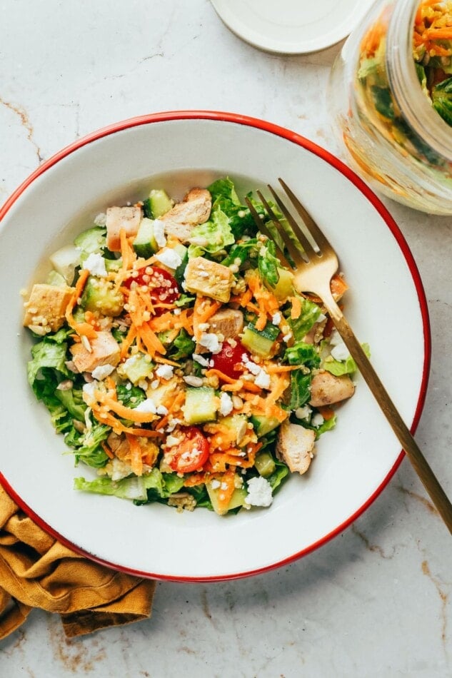 Mason jar salad served in a bowl.