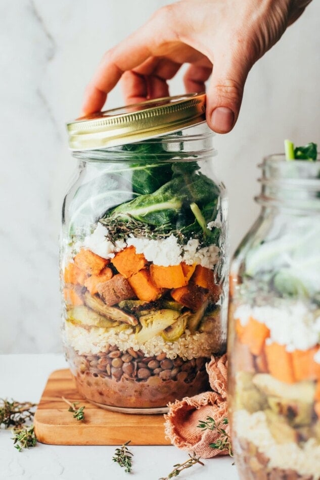 Ingredients for sweet potato lentil mason jar salad layered in a jar.