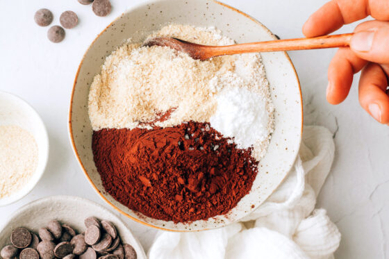 Mixing together oat flour, brewers yeast, cocoa powder, sea salt and baking powder.