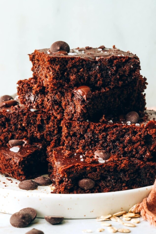 Oat Flour Brownies stacked on a plate.