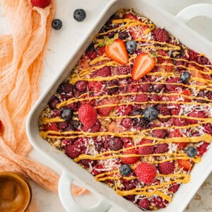 Overhead view of a square baking dish containing baked oatmeal.