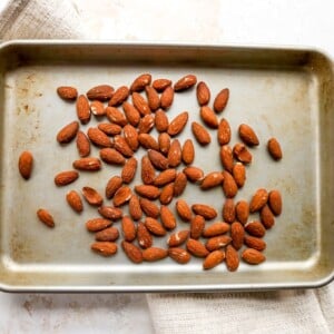 Toasted almonds on a sheet pan.