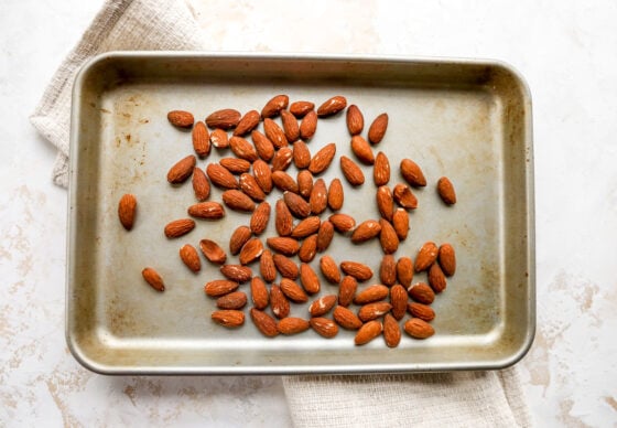 Toasted almonds on a sheet pan.