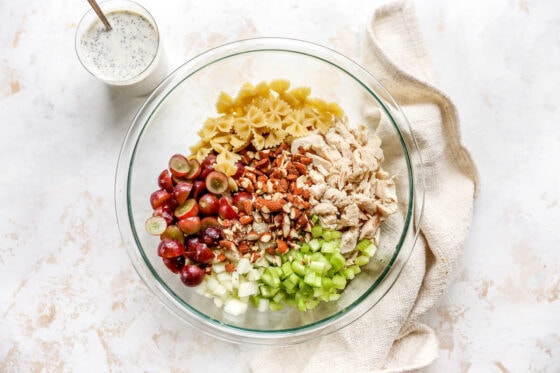 Ingredients for pasta salad in a bowl.