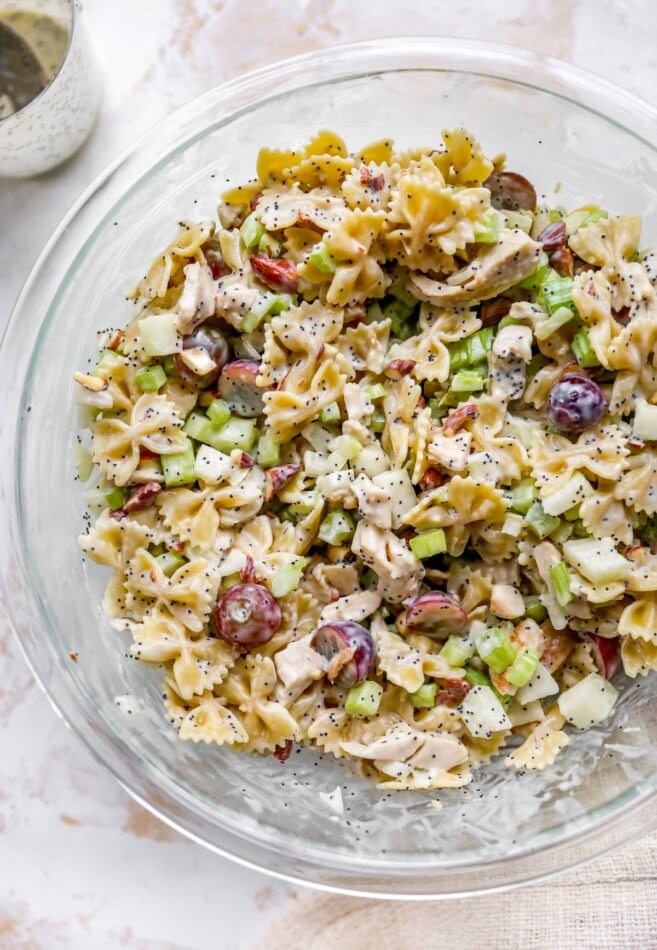 Poppyseed chicken pasta salad in a mixing bowl.