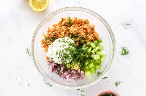 Ingredients for salmon salad in a bowl.