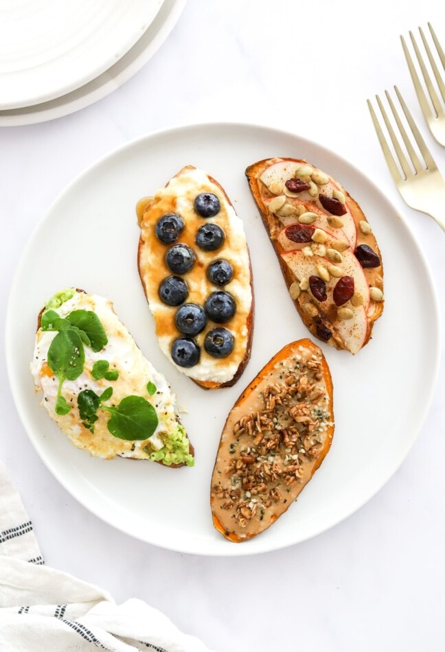 Pin this image to save the recipe for these delish Breakfast Sweet Potato Toast Four Ways! Four varieties of sweet potato toast on a plate.