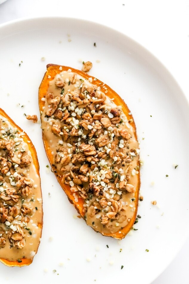 Close up of nut butter and granola sweet potato toast slice.