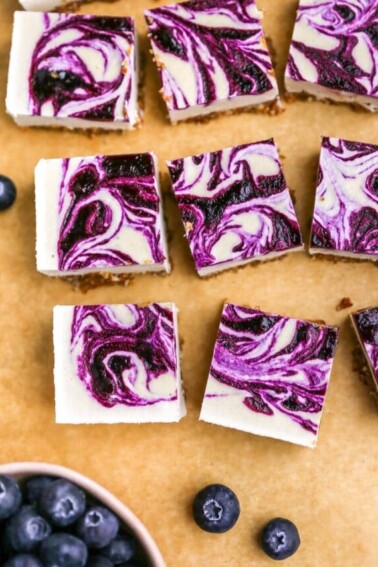 cropped-vegan-blueberry-cheesecake-bars-overhead-bars-on-parchment-2.jpg