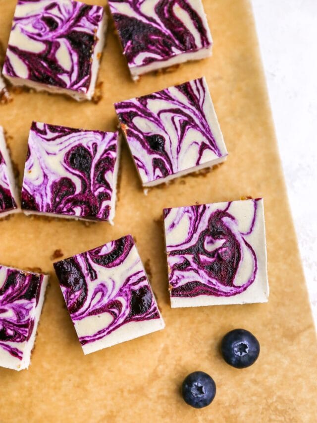 cropped-vegan-blueberry-cheesecake-bars-overhead-bars-on-parchment.jpg