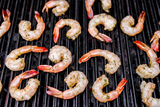 Shrimp being cooked on a grill.