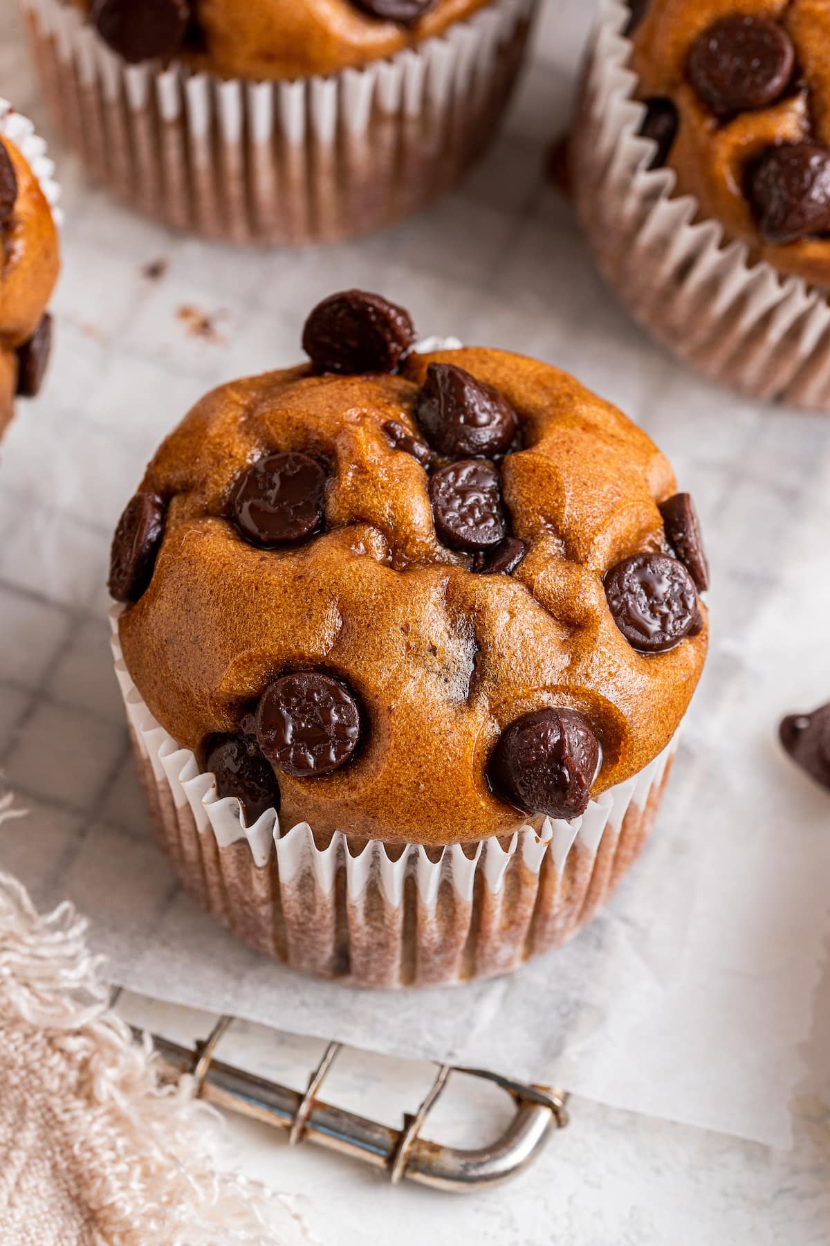 A protein muffin in paper wrapper.