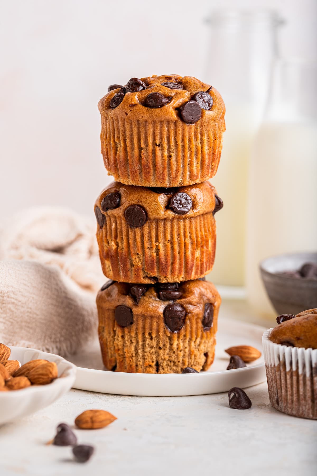 Three protein muffins stacked on top of each other.