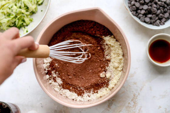 Dry ingredients being whisked together in a bowl.