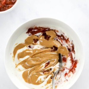 Yogurt Bowl Topped with peanut butter and jam.