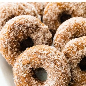 Pumpkin spice donuts on a platter.