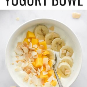 Yogurt bowl topped with coconut, mango and banana.