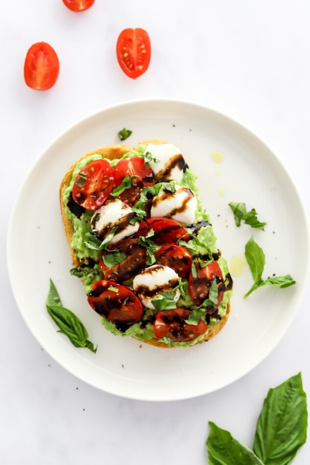 Caprese Avocado Toast served on a plate.