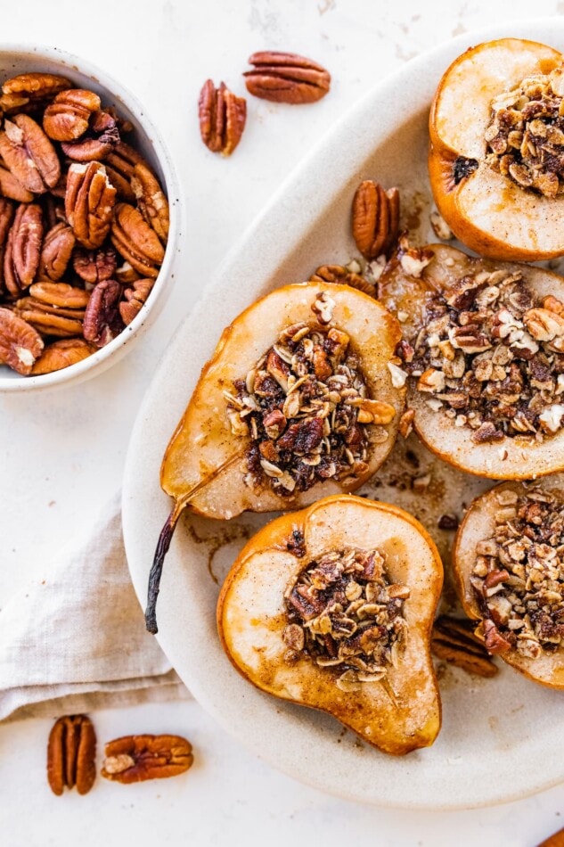 Overhead view of baked pears in a serving platter.