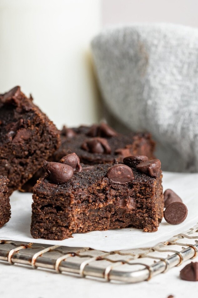 A pumpkin brownie with a bite taken out of it.