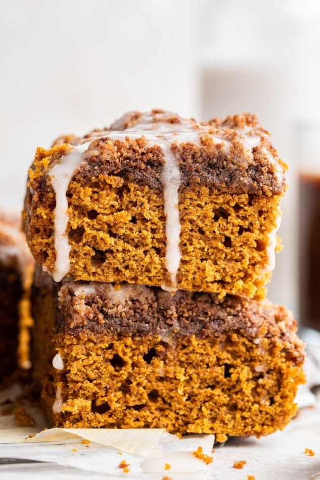 Two coffee cake squares stacked on top of each other.