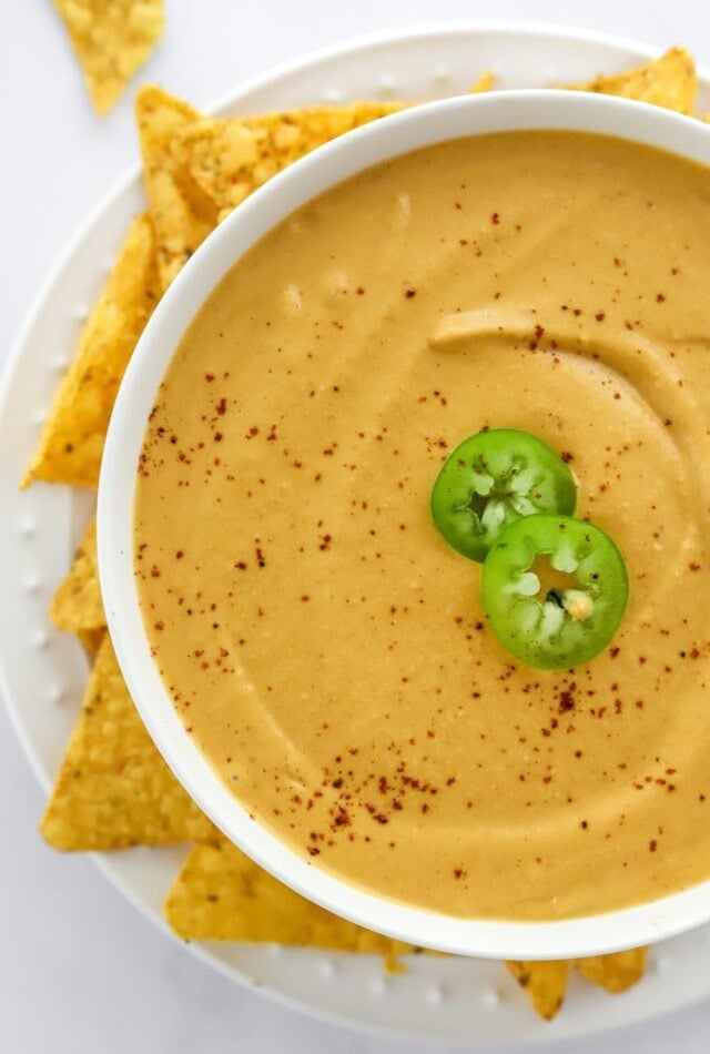 Close up of vegan queso in a bowl.
