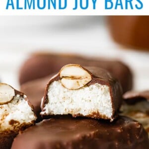 A halved almond joy bar stacked on top of a full bar.