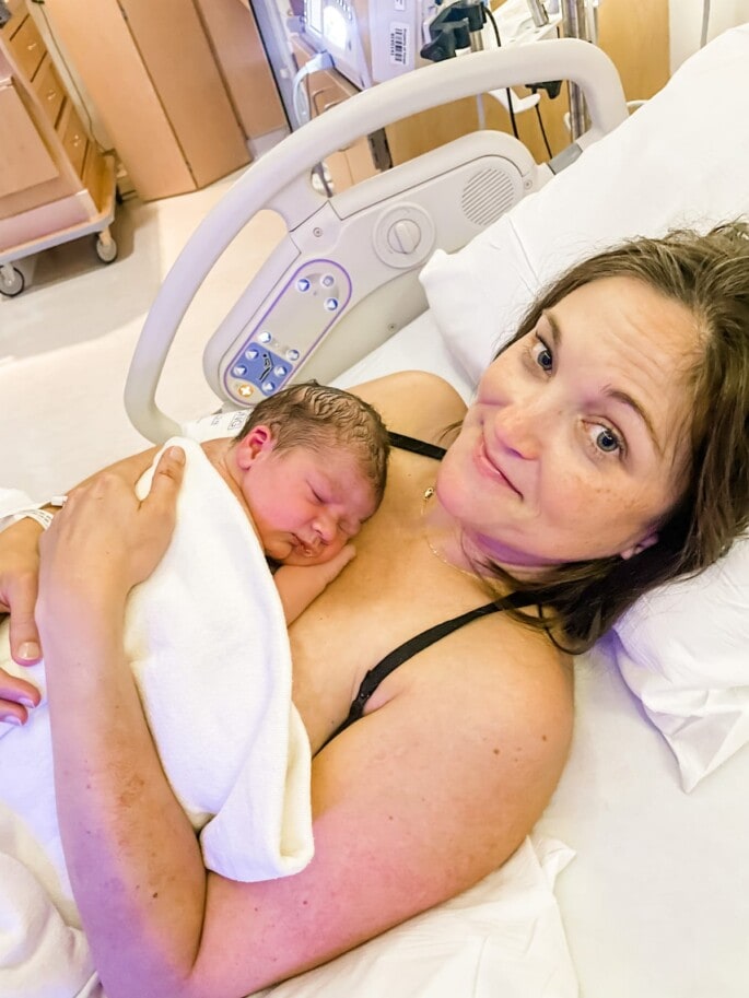 Newborn baby boy on Mom's chest after birth.