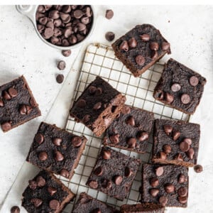 Pumpkin brownies on a small cooling rack.