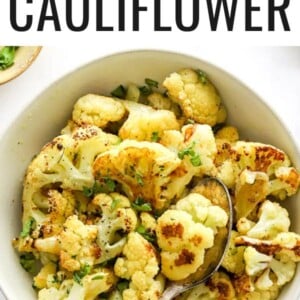 Bowl of roasted cauliflower garnished with fresh parsley.