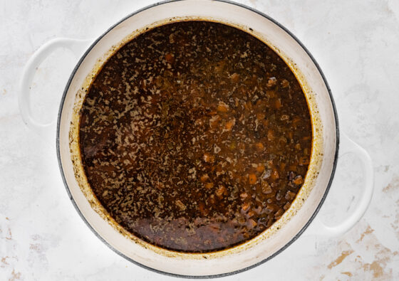 Black bean soup cooking in a pot.