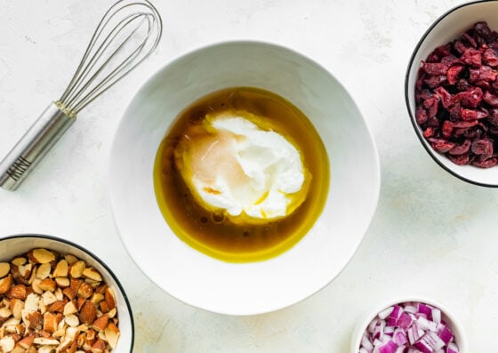 Greek yogurt, apple cider vinegar, oil, maple syrup and salt in a small mixing bowl.