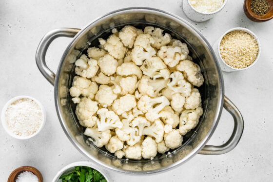 Cauliflower florets in a steamer basket.