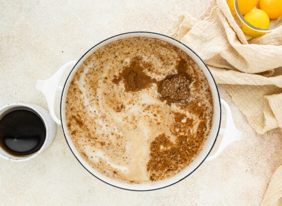 Almond milk, coconut milk, vanilla, cinnamon, nutmeg and cloves in a sauce pan.