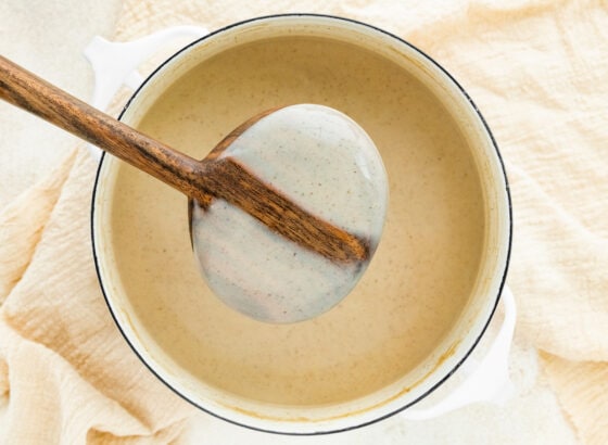 Dairy free eggnog coating the back of a spoon.