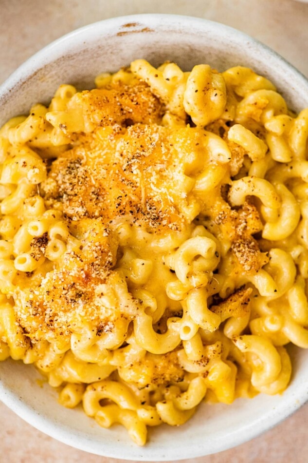 A bowl full of baked mac and cheese.