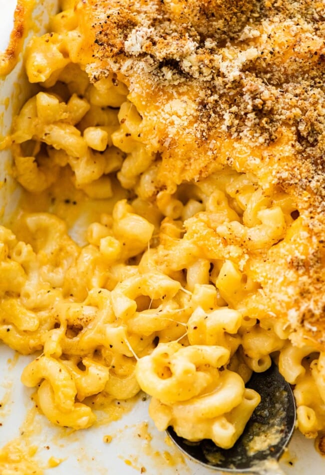A close up of healthy baked mac and cheese in a dish.