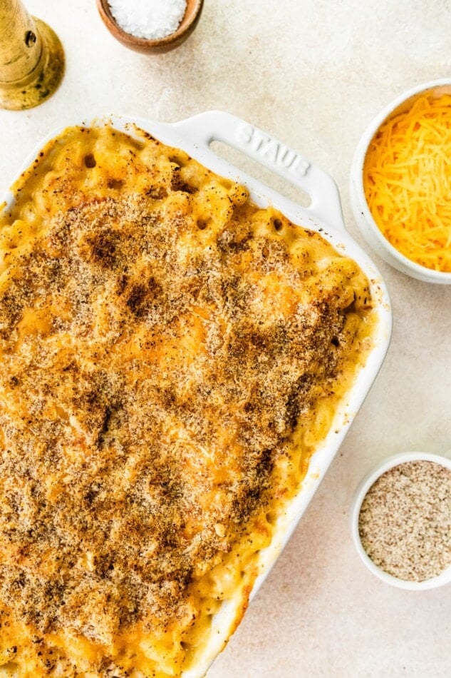 A rectangular baking dish containing baked mac and cheese.
