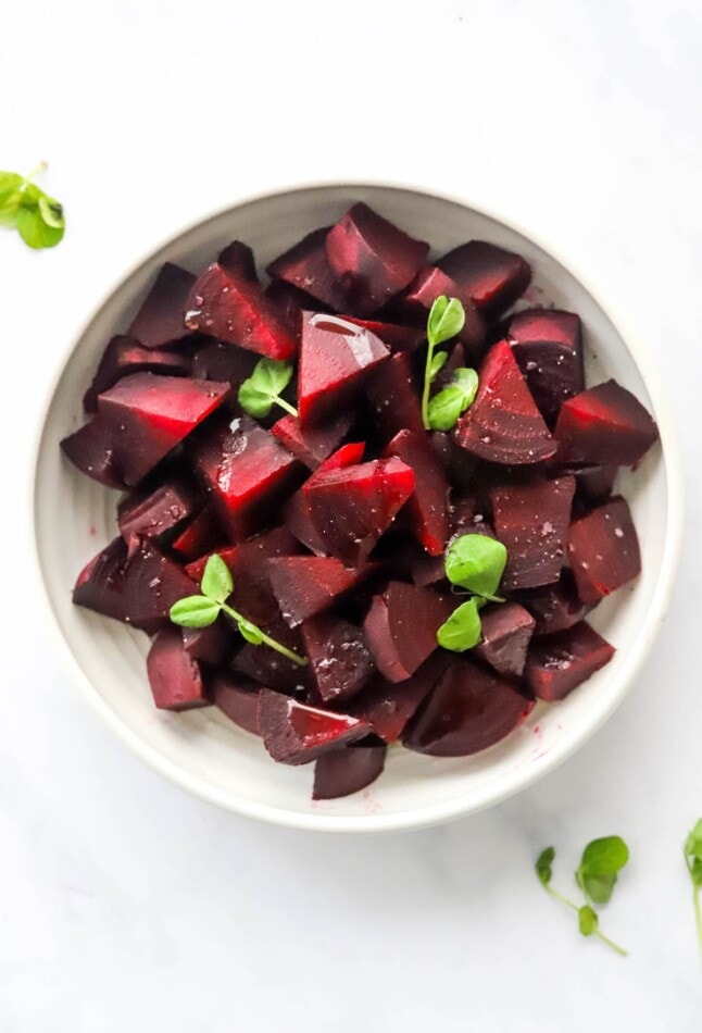 A bowl containing chopped and cooked beets.