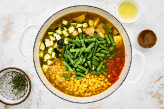 Vegetables and stock added to the pot.