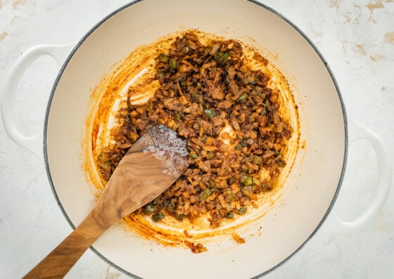 Onions, jalapeños and spices mixed together in a sauce pan.