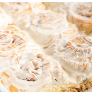 Cream cheese frosted gluten-free cinnamon rolls.