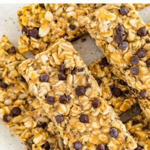 Nut free granola bars on a plate studded with chocolate chips and chia seeds.