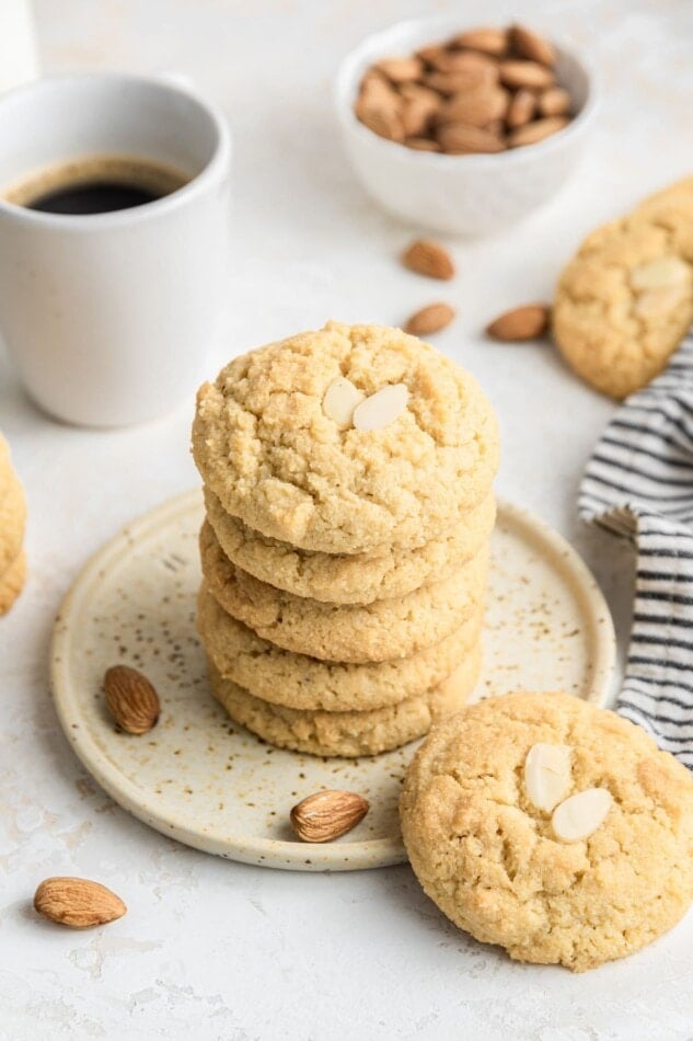 A stack of almond cookies on a small plate.