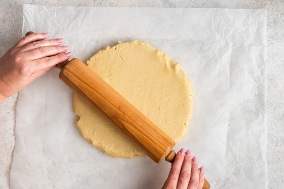 Rolling out gluten-free cinnamon roll dough.