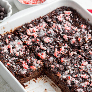 A square missing from a baking dish of chocolate peppermint baked oatmeal.