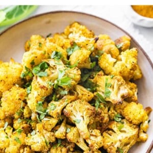Curry roasted cauliflower in a bowl.