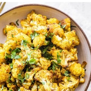 Curry roasted cauliflower in a bowl.