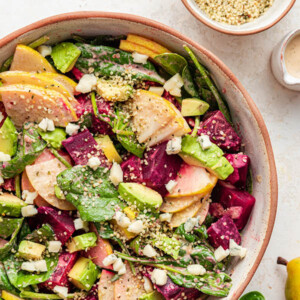 Serving bowl with pear and beet salad.