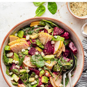 Serving bowl with pear and beet salad.